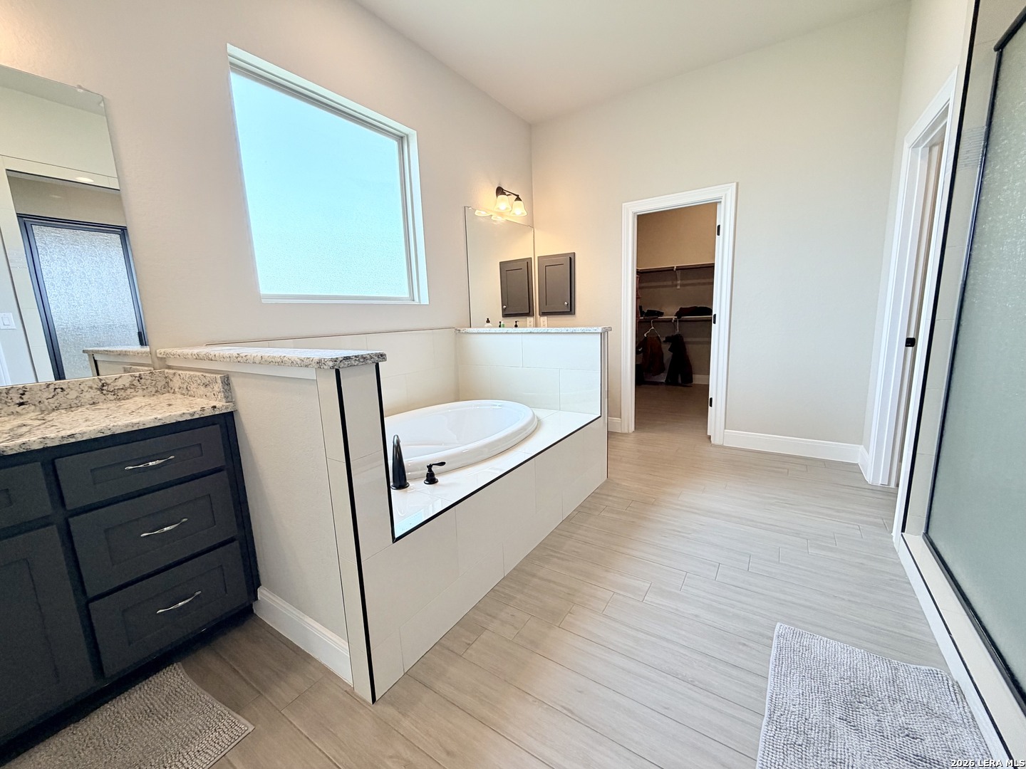 615 Abbott Ridge Converse, TX 78109 - Photo 17 of 26 a bathroom with a sink and a mirror