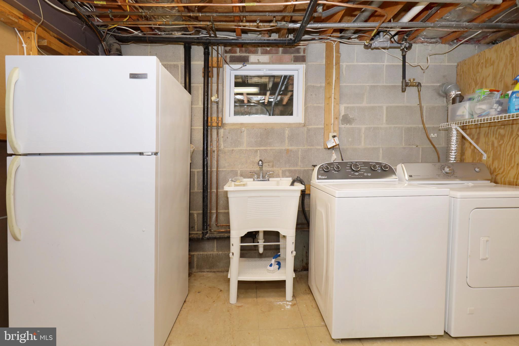 6805 Houndmaster Road Springfield, VA 22152 - Photo 37 of 52 Laundry Area, Deep Sink, Fridge and Storage