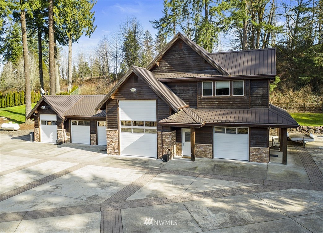 4731 Weber Road Snohomish, WA 98290 - Photo 30 of 40 a front view of a house with a garden