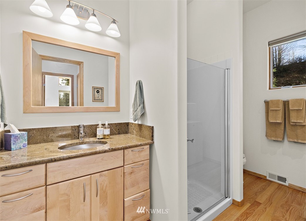 4731 Weber Road Snohomish, WA 98290 - Photo 33 of 40 a bathroom with mirror sink and vanity