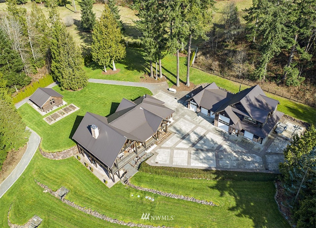 4731 Weber Road Snohomish, WA 98290 - Photo 10 of 40 an aerial view of a house with a garden and swimming pool