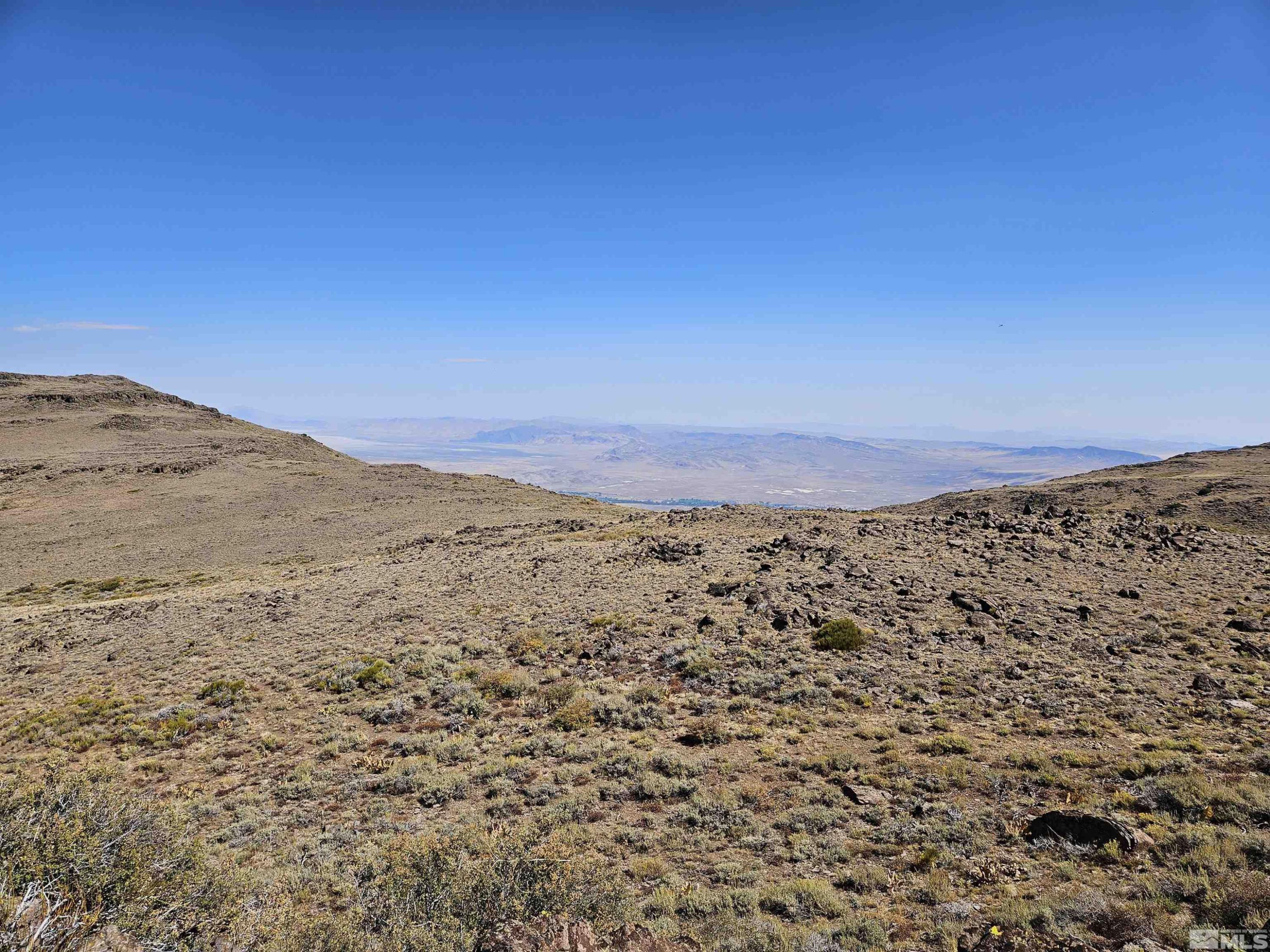 80 Rodero Road Reno, NV 89510 - Photo 5 of 12 a view of a field with mountains in the background