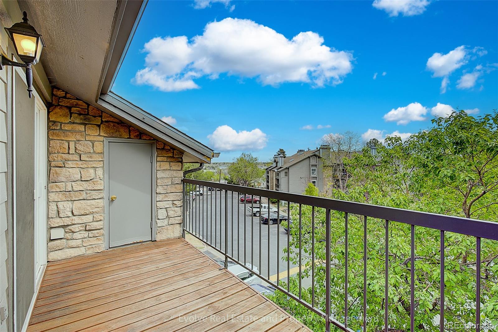 2575 South Syracuse Way, Unit J301 Denver, CO 80231 - Photo 2 of 14 a view of a balcony with a potted plant