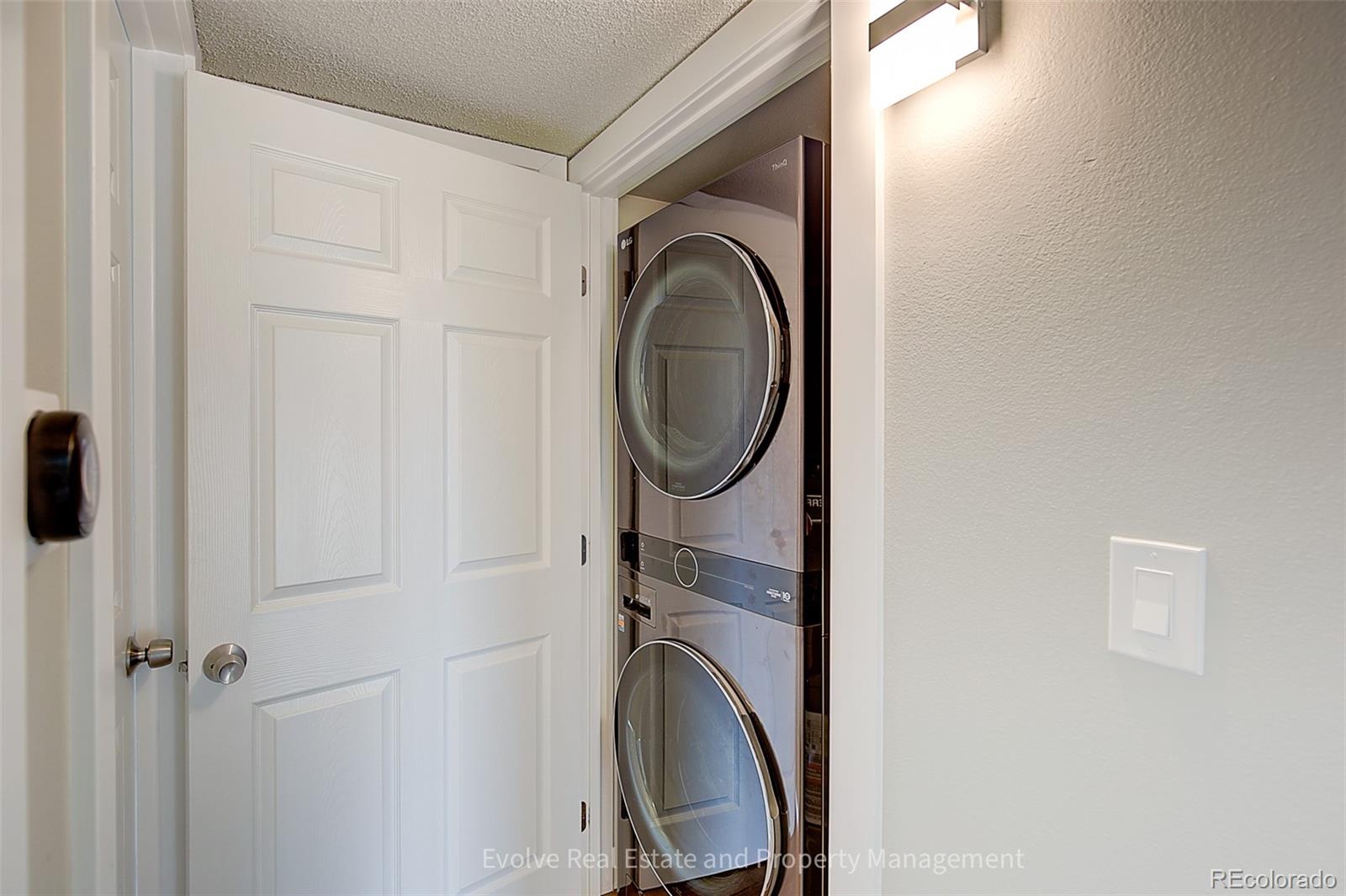 2575 South Syracuse Way, Unit J301 Denver, CO 80231 - Photo 10 of 14 a utility room with dryer and washer