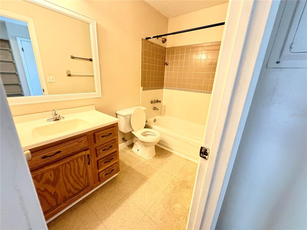 7011 Southwest 17th Place Gainesville, FL 32607 - Photo 15 of 22 a bathroom with a sink and a mirror