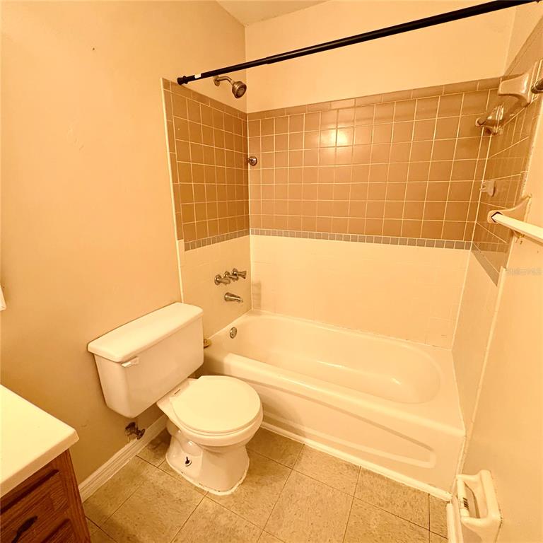 7011 Southwest 17th Place Gainesville, FL 32607 - Photo 16 of 22 a bathroom with a toilet and a shower