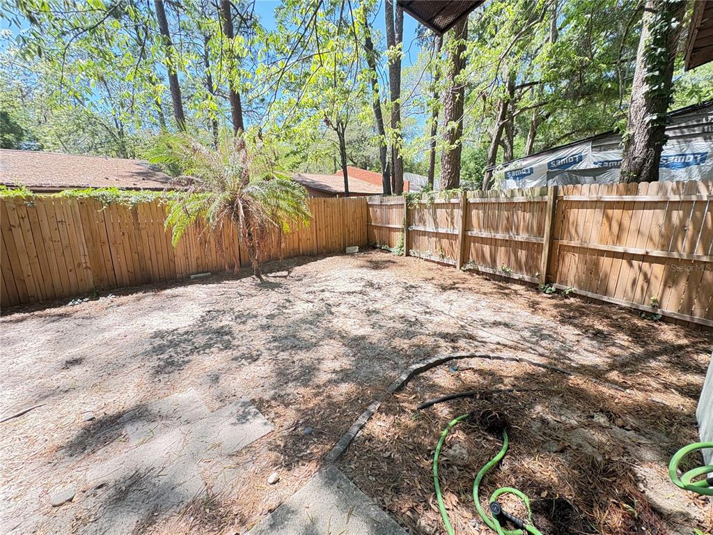 7011 Southwest 17th Place Gainesville, FL 32607 - Photo 21 of 22 a view of a backyard of the house