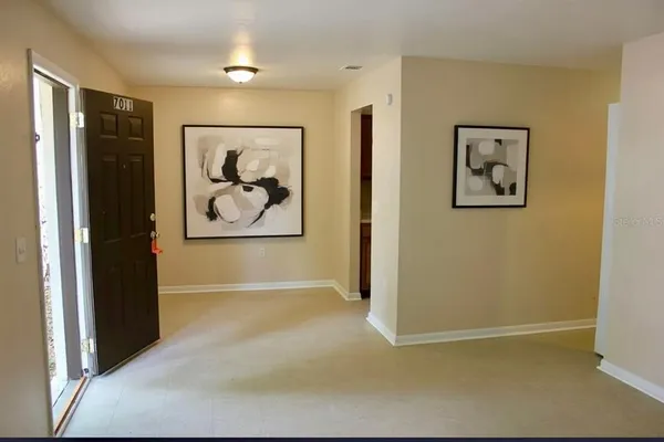a kitchen with a refrigerator sink stove and cabinets