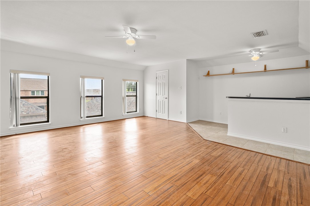 623 Broadway Boulevard Portland, TX 78374 - Photo 28 of 35 a view of an empty room with window and wooden floor