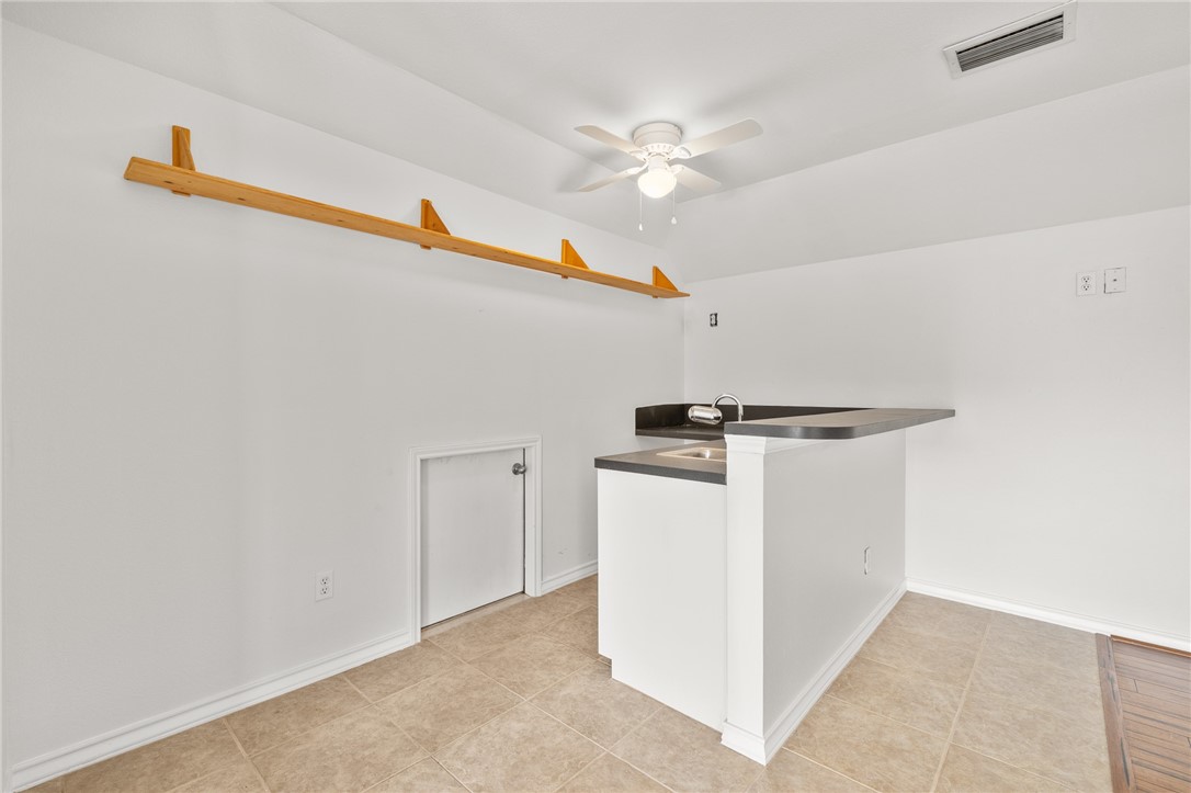 623 Broadway Boulevard Portland, TX 78374 - Photo 29 of 35 a view of storage and utility room with washer and dryer