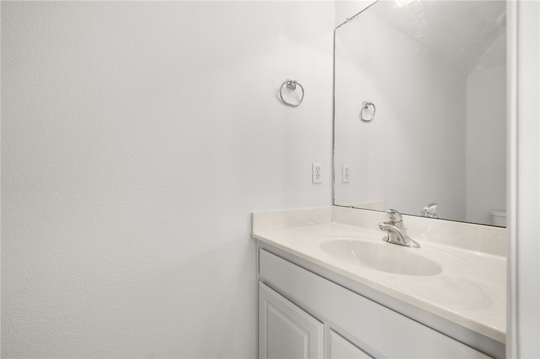623 Broadway Boulevard Portland, TX 78374 - Photo 30 of 35 a bathroom with a sink and a mirror