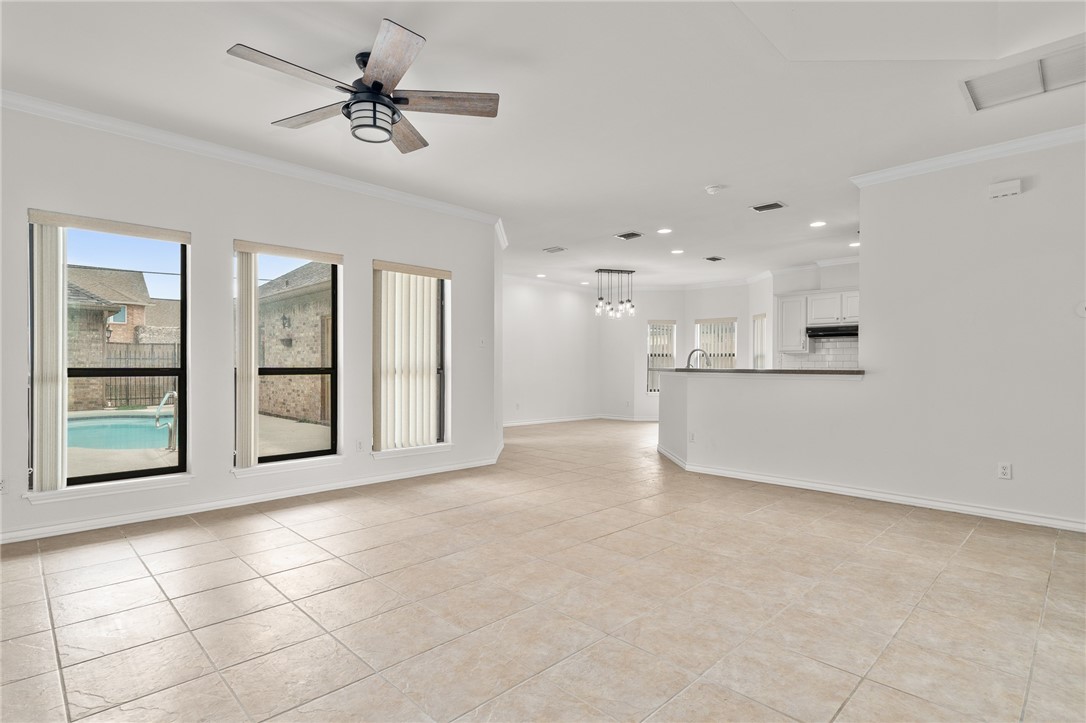 623 Broadway Boulevard Portland, TX 78374 - Photo 5 of 35 a big room with chandelier fan and windows