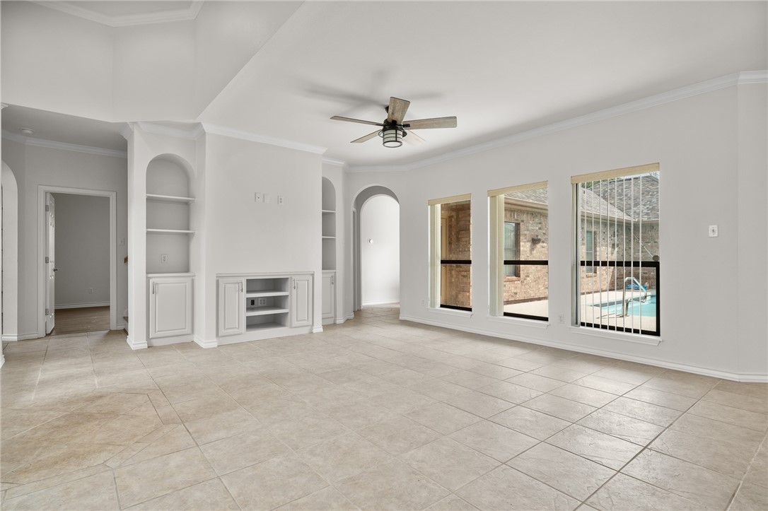 623 Broadway Boulevard Portland, TX 78374 - Photo 6 of 35 an empty room with windows and ceiling fan