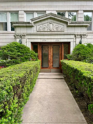 a view of a building with a garden