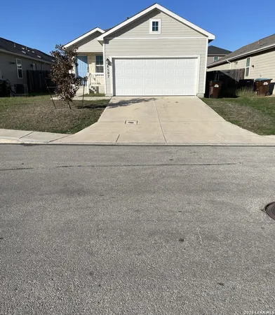 a view of house with garage