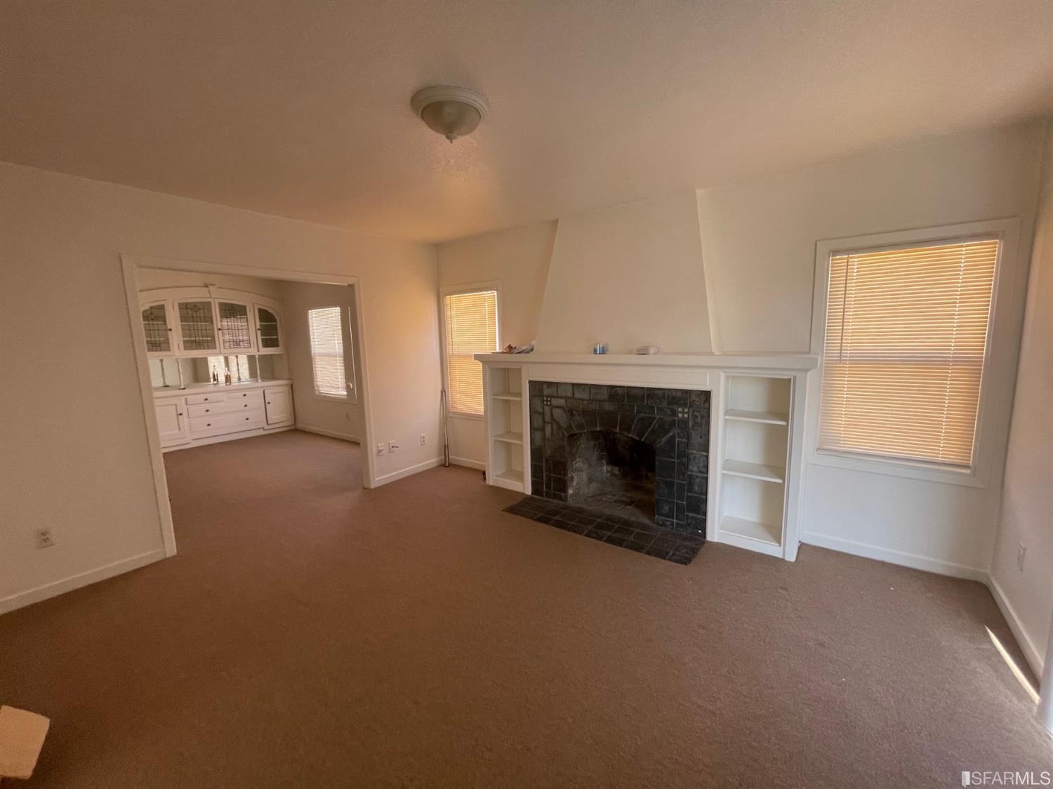2135 7th Avenue Oakland, CA 94606 - Photo 2 of 10 a view of empty room with a fireplace