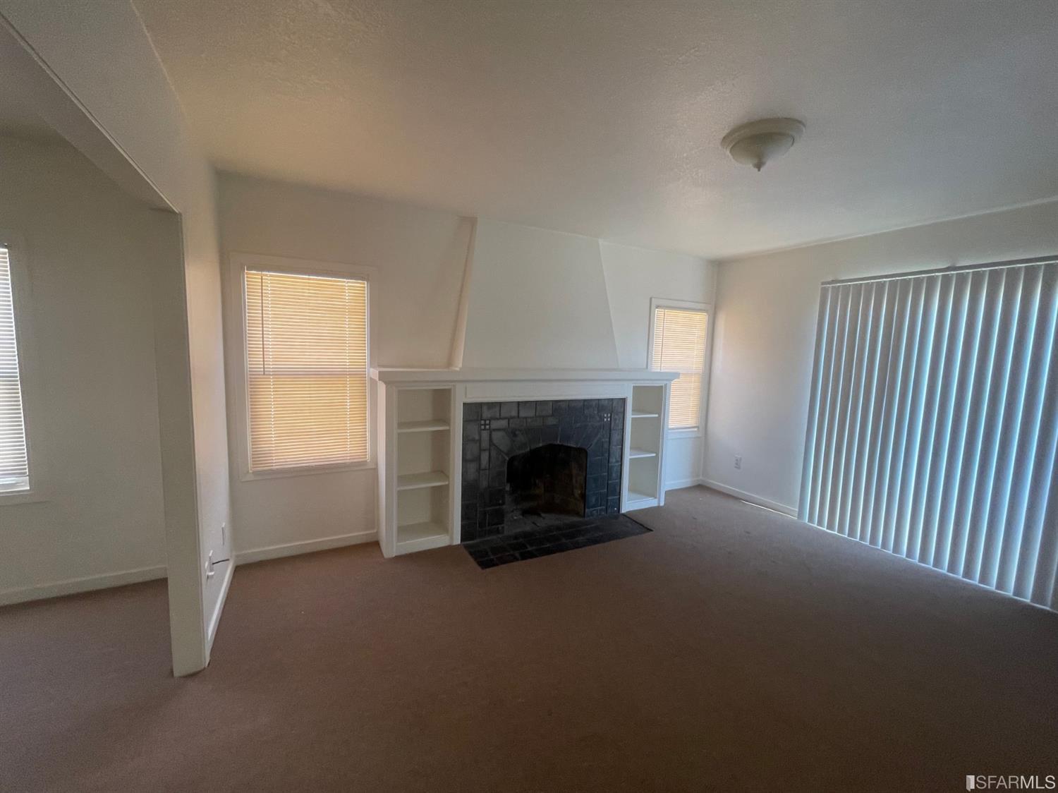 2135 7th Avenue Oakland, CA 94606 - Photo 3 of 10 a view of empty room with a fireplace