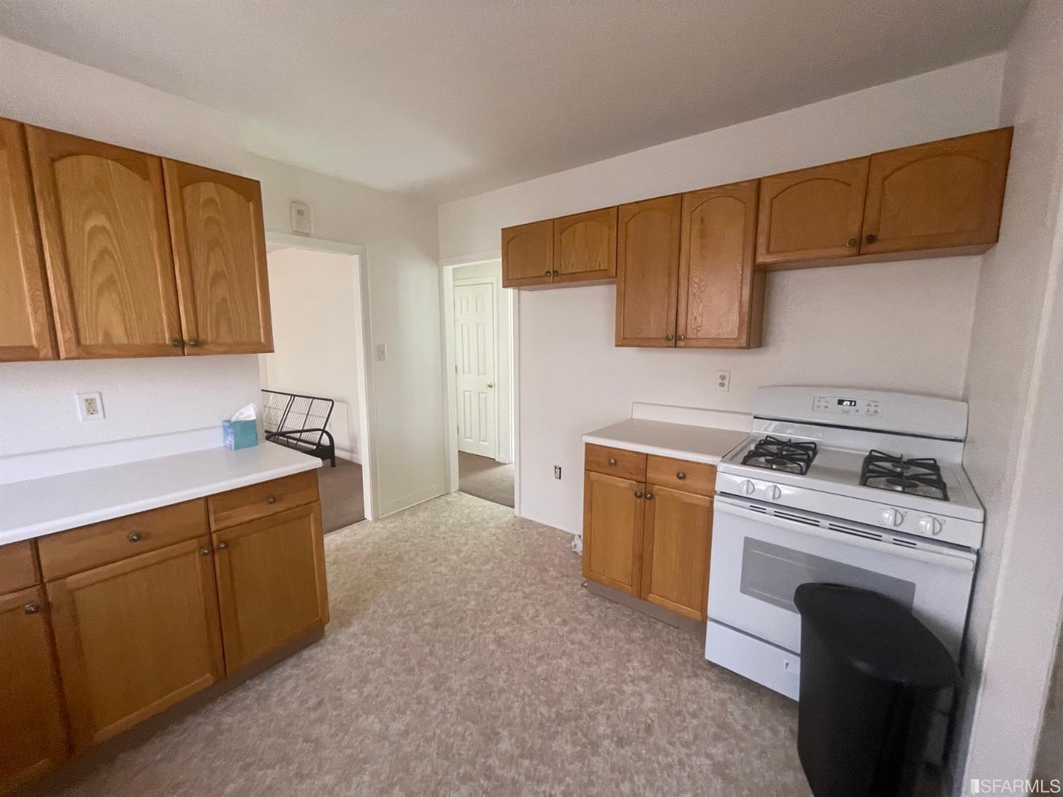 2135 7th Avenue Oakland, CA 94606 - Photo 6 of 10 a kitchen with a stove top oven sink and cabinets