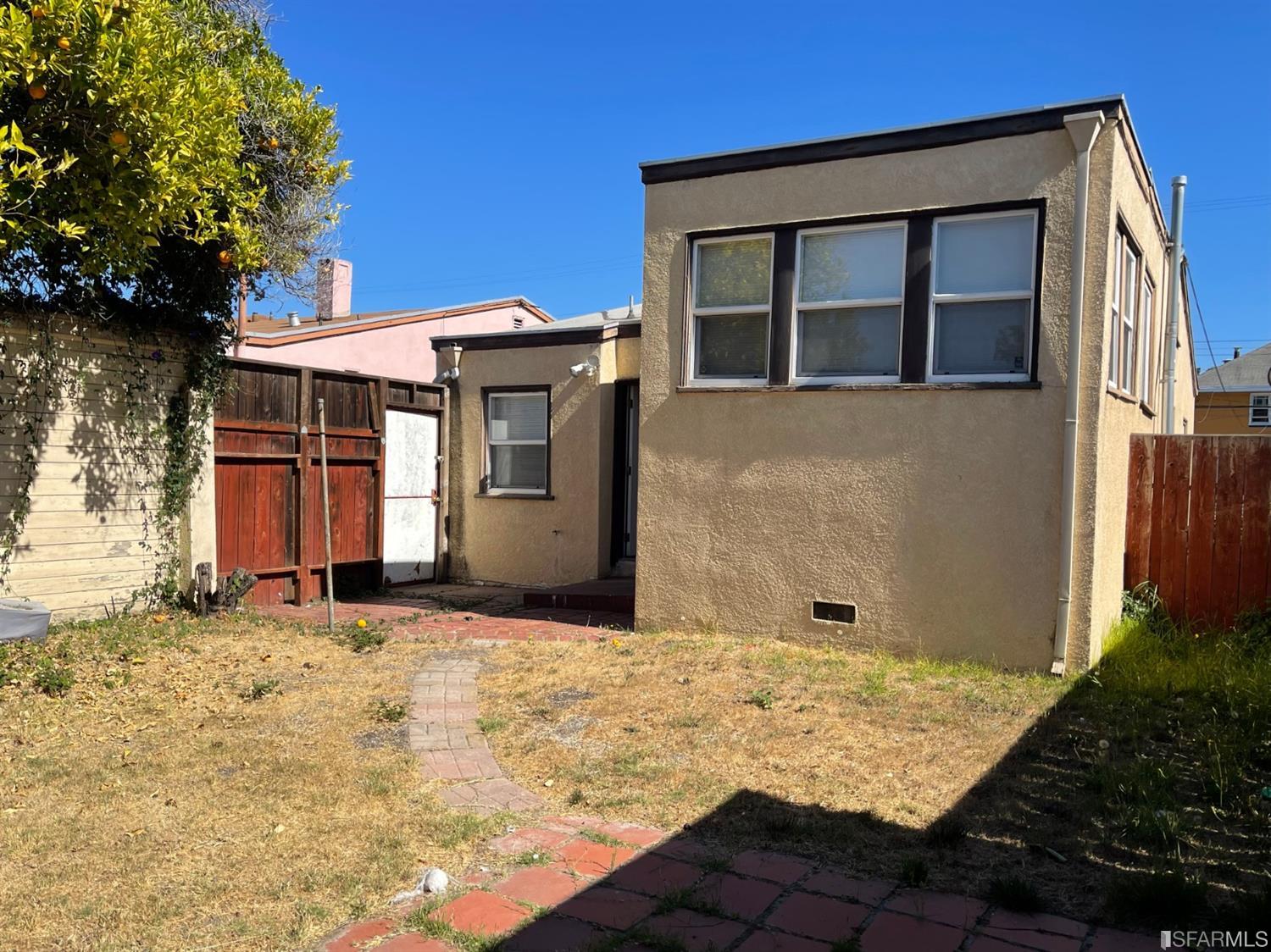 2135 7th Avenue Oakland, CA 94606 - Photo 9 of 10 a front view of a house with a yard