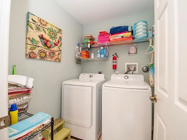 a utility room with dryer and washer