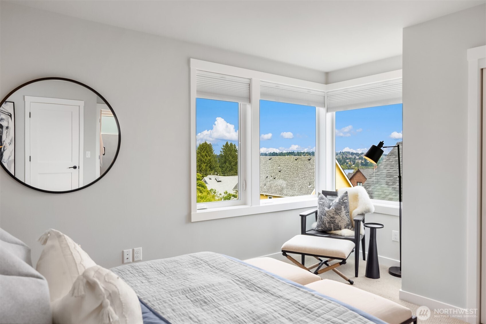 516 North 61st Street, Unit B Seattle, WA 98103 - Photo 11 of 17 a bedroom with a bed and a chair with the potted plant