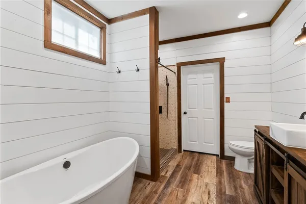 a bathroom with a tub and shower