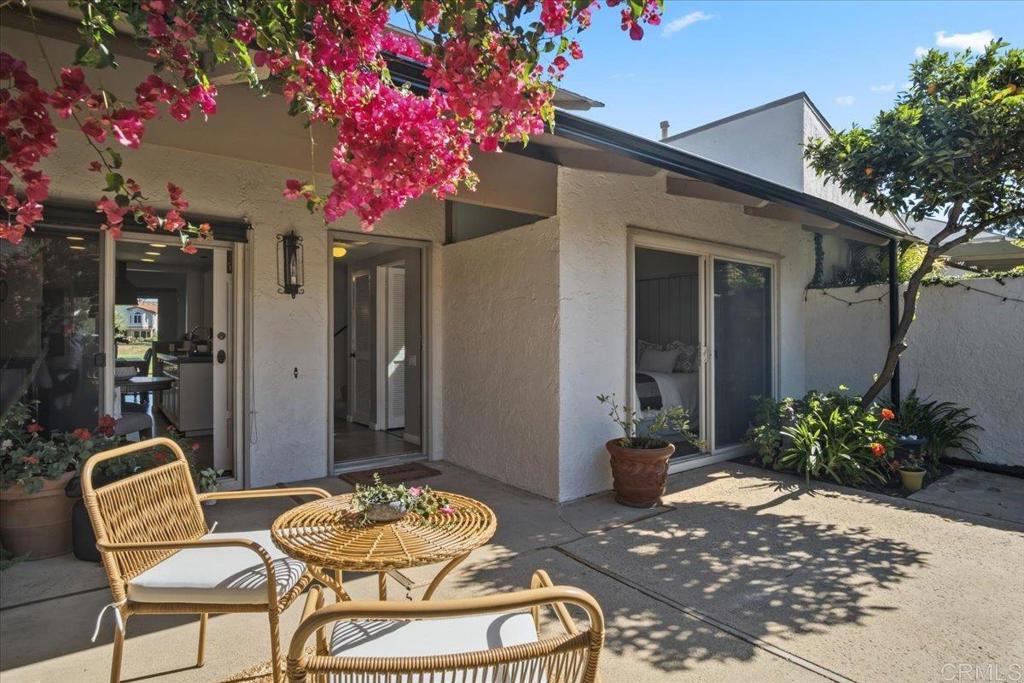 213 Via Osuna Rancho Santa Fe, CA 92091 - Photo 19 of 58 a patio with a table and chairs and potted plants