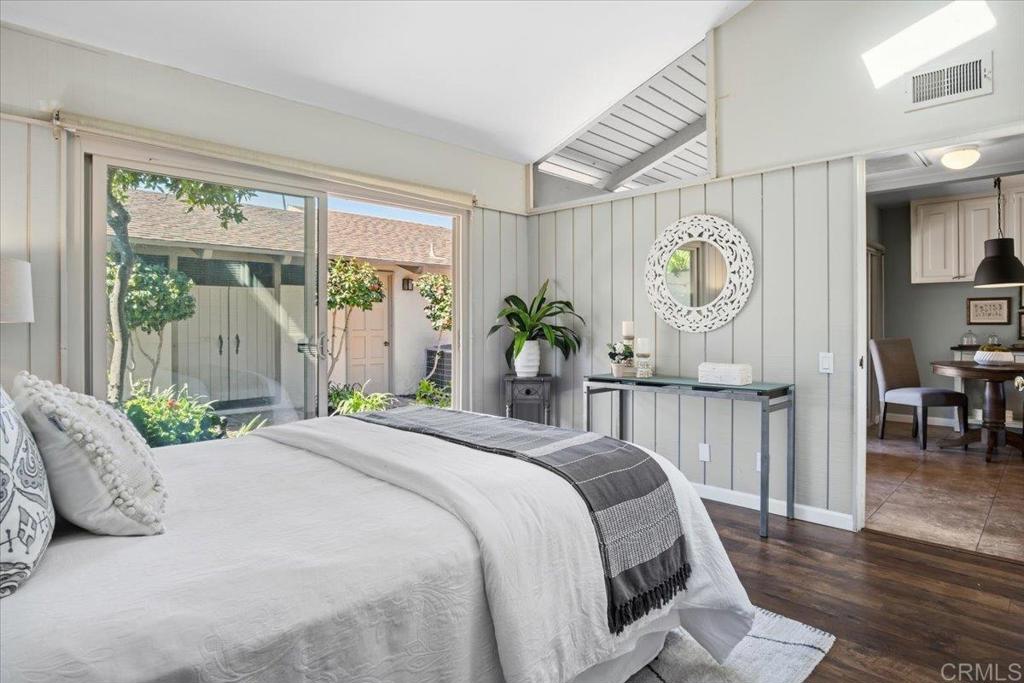 213 Via Osuna Rancho Santa Fe, CA 92091 - Photo 20 of 58 a bedroom with a large bed and a large window