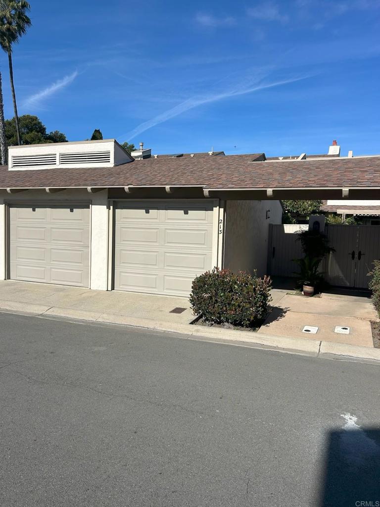 213 Via Osuna Rancho Santa Fe, CA 92091 - Photo 2 of 58 a front view of a house with a yard