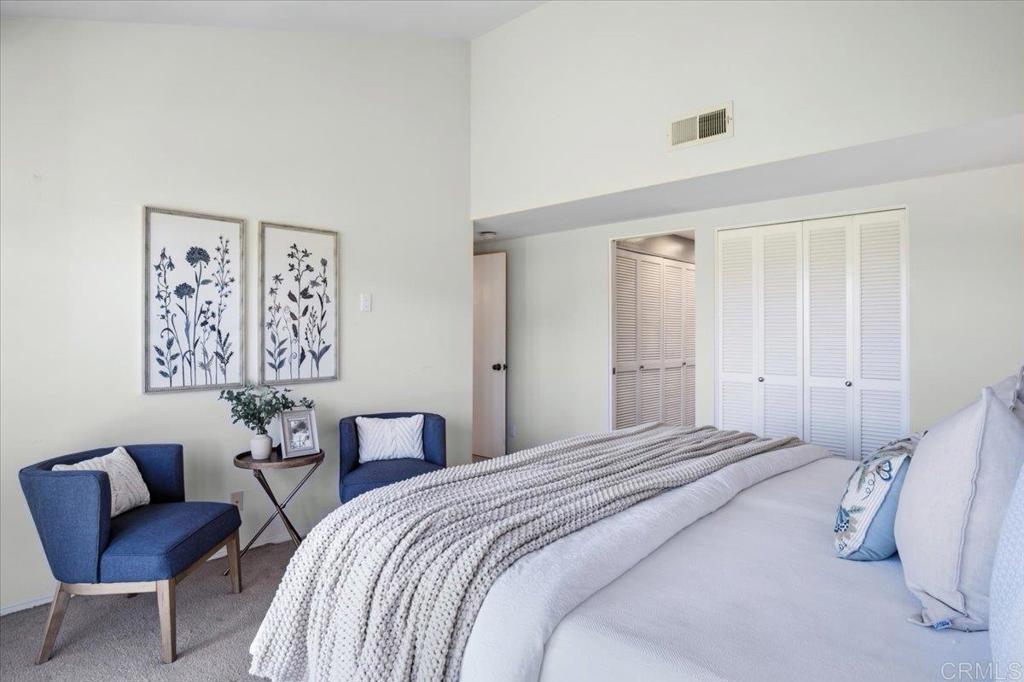 213 Via Osuna Rancho Santa Fe, CA 92091 - Photo 26 of 58 a bedroom with a bed and a chair