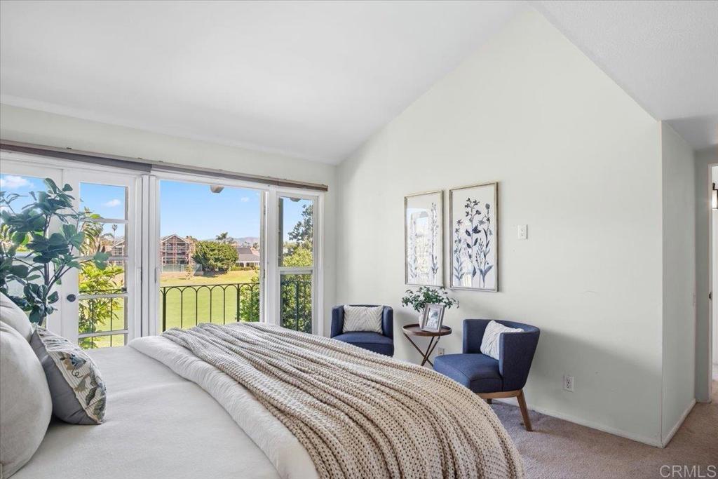 213 Via Osuna Rancho Santa Fe, CA 92091 - Photo 27 of 58 a bedroom with a bed and a large window