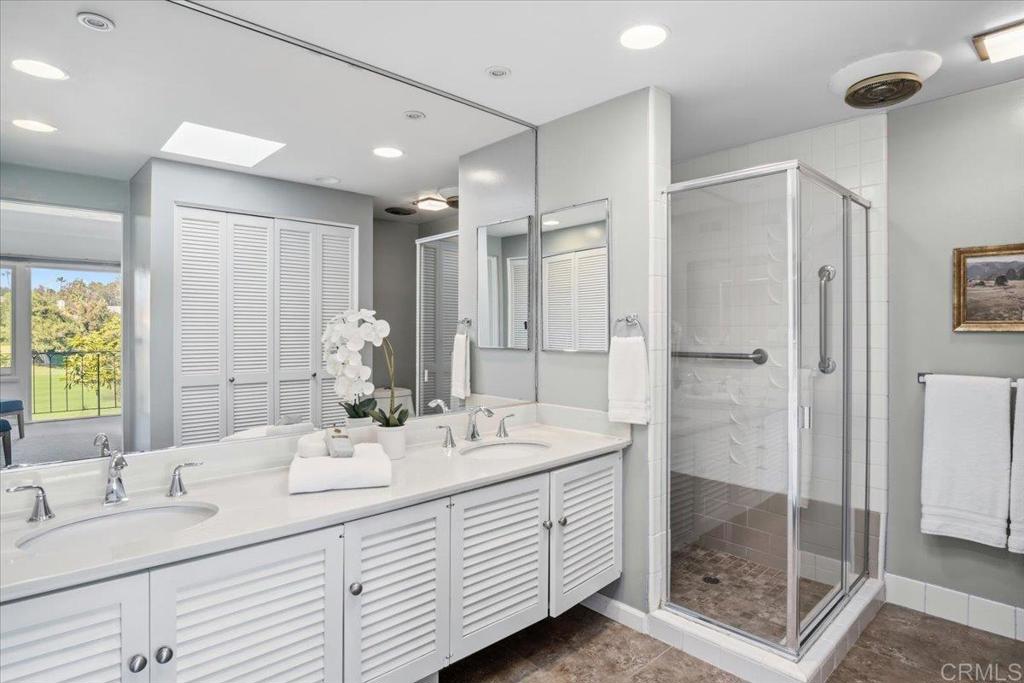 213 Via Osuna Rancho Santa Fe, CA 92091 - Photo 32 of 58 a bathroom with a double vanity sink mirror and shower