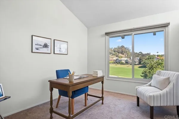 a bathroom with a sink mirror and vanity