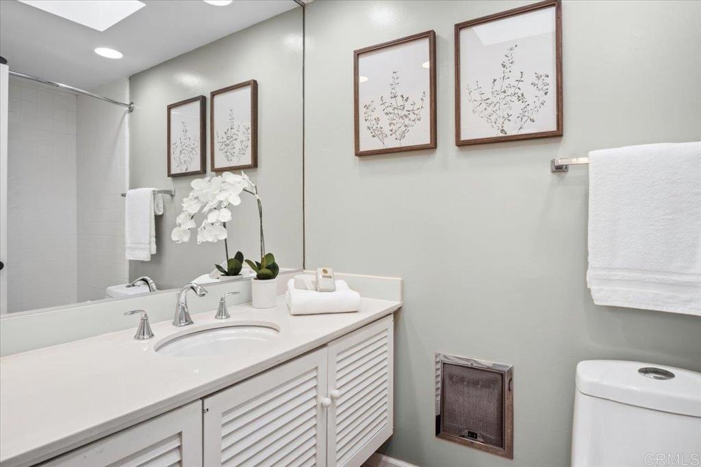213 Via Osuna Rancho Santa Fe, CA 92091 - Photo 39 of 58 a bathroom with a sink mirror and vanity