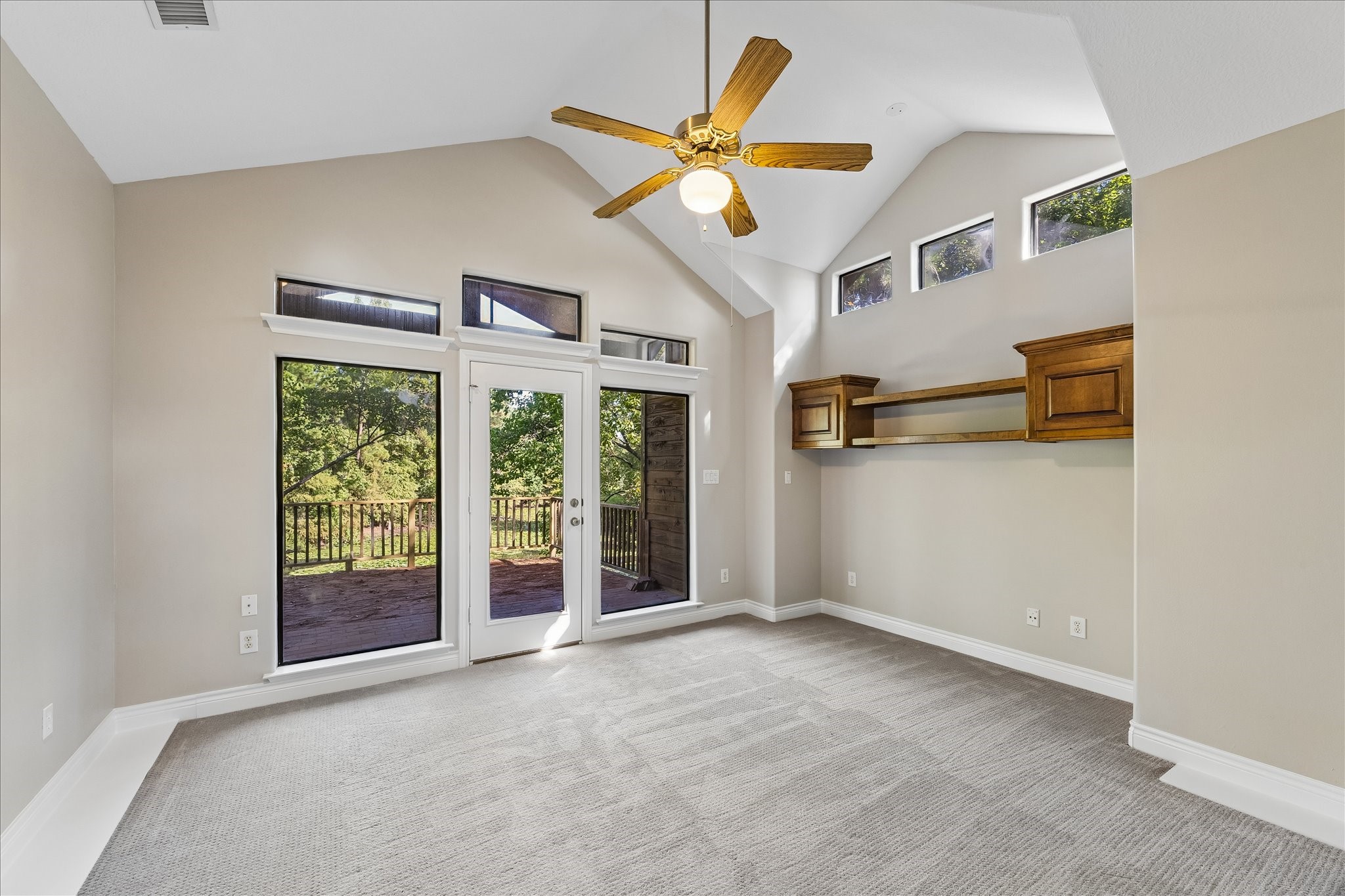 424 Nursery Road Spring, TX 77380 - Photo 12 of 16 Secondary bedroom on the second floor with a beautiful view of the pond and access to the second floor balcony.