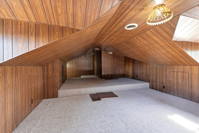 292 West 400 South Springville, UT 84663 - Photo 17 of 37 Carpeted room featuring wood-finish paneling on walls and vaulted ceilings