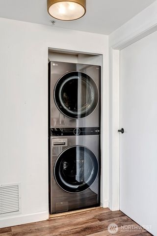 a view of a livingroom with washer and dryer