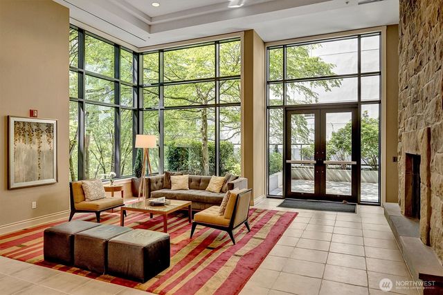 a living room with furniture and a large window