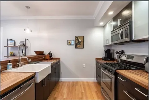a kitchen that has a sink and a stove