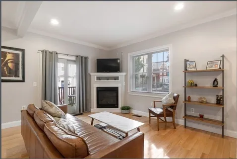 a bedroom with furniture and a fireplace