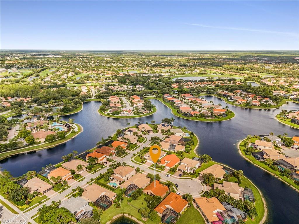1415 Princess Sabal Point Naples, FL 34119 - Photo 30 of 42 Aerial perspective showcasing a residential community with numerous water features