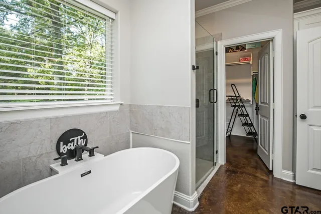 a bathroom with a bathtub and a sink