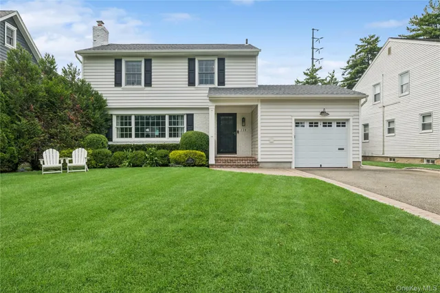 a view of a house with a backyard