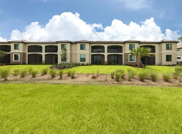 a view of a swimming pool with a yard