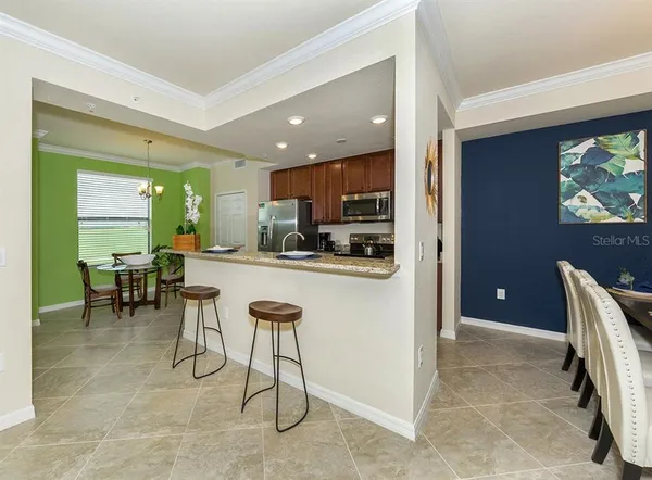 a kitchen with a table and chairs