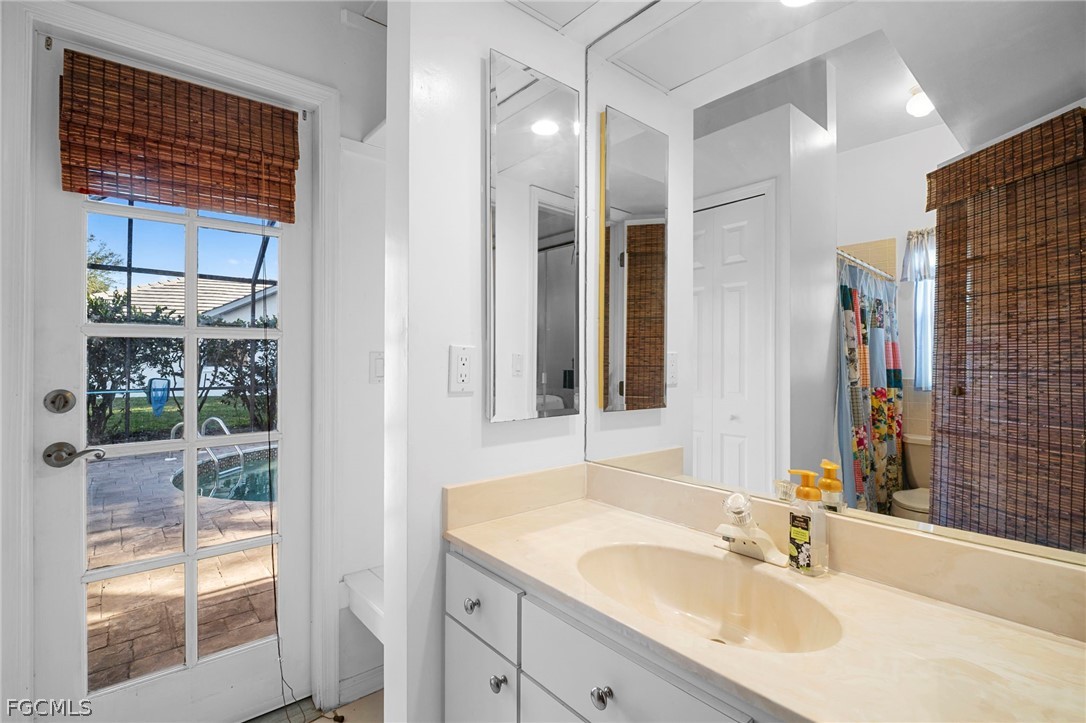 11772 Mahogany Run Fort Myers, FL 33913 - Photo 39 of 50 a bathroom with a sink and a mirror