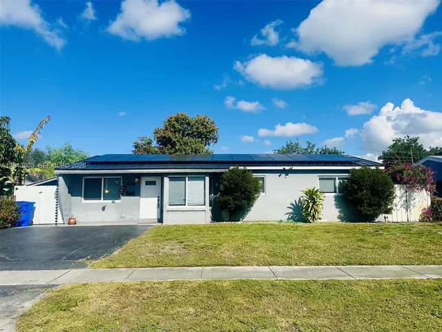 a view of house with yard