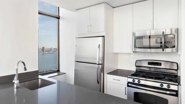 a kitchen with a refrigerator stove and a sink