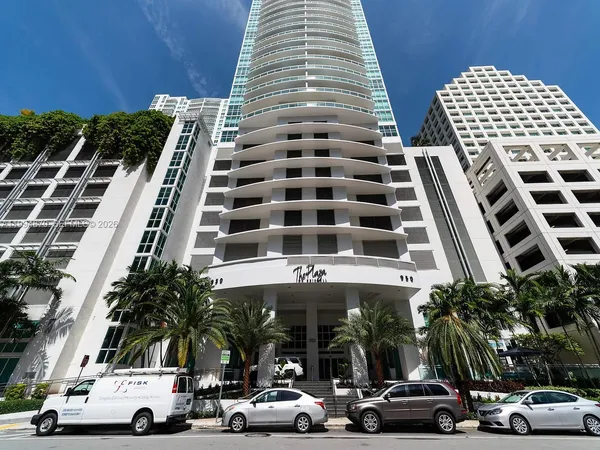 front view of building with cars parked