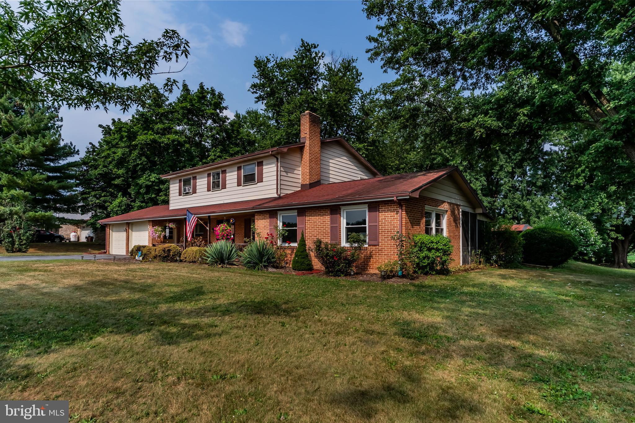 335 Wolfs Bridge Road Carlisle, PA 17013 - Photo 2 of 37 front view of a house with a yard